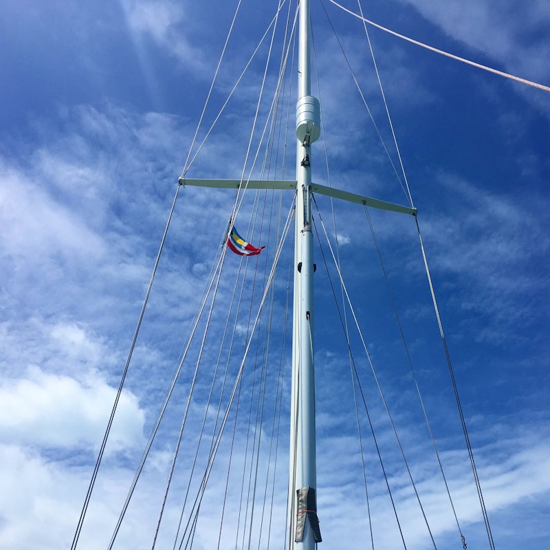 Our tattered Bahamas flag on the starboard spreader.